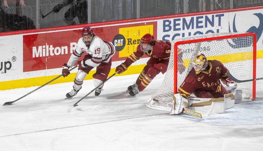 UMass right wing Cole O'Hara (19) keeps the puck from Boston College defenseman Drew Fortescue (5) during the college hockey game at the Mullins Center, Saturday, Feb. 15, 2025, in Amherst.