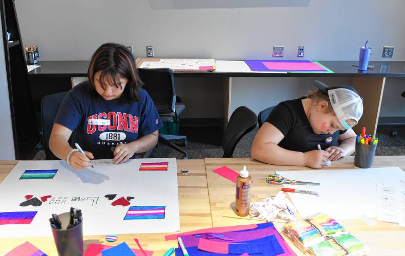 Autumn Pickup, 12, and Tianna Valdez, 10, both of Greenfield, make Pride swag at the Makerspace at the Greenfield Public Library on Tuesday.