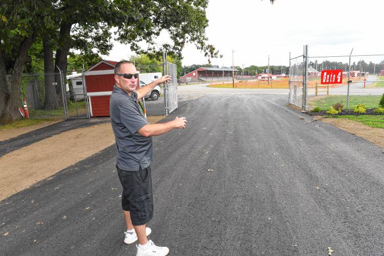 Michael Nelson, president of the Franklin County Agricultural Society, at the Franklin County Fairgrounds newly reconfigured and paved back entrance.