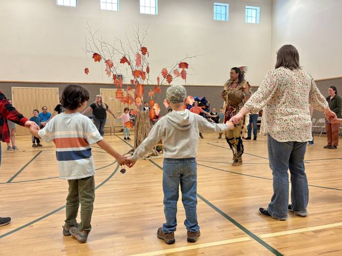 Rowe Elementary School students and staff members perform a series of Indigenous dances they learned from Annawon Weeden of the Mashpee Wampanoags.