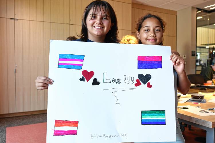 Autumn Pickup, 12, and Pippy Kaham, 11, both of Greenfield, with Pride swag at the Makerspace at the Greenfield Public Library on Tuesday.