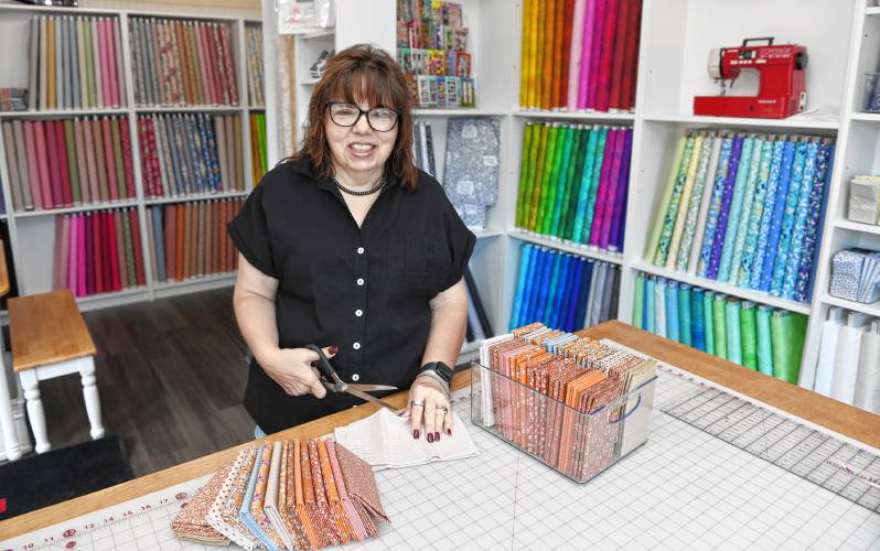Donna Giard in the retail store at her Where We Create quilt shop and studio in Bernardston. 