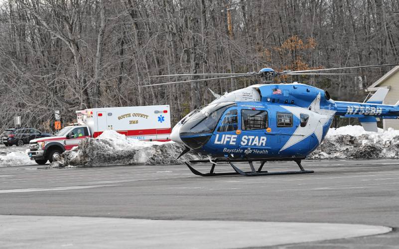 A LIFE STAR helicopter and a South County EMS ambulance at the South County EMS building and the South Deerfield Fire District on Monday.