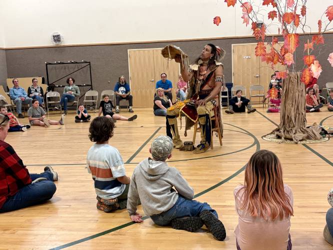 Annawon Weeden tells a story to Rowe Elementary School students. As director of the nonprofit First Light Foundation, Weeden aims to educate people about Wampanoag history and culture.