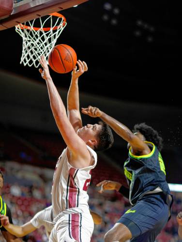 UMass forward Josh Cohen (23) drives to the hoop before being fouled by South Florida’s Gerald Jones (21) earlier this season at the Mullins Center in Amherst. UMass forward Josh Cohen (23) drives to the hoop before being fouled by South Florida’s Gerald Jones (21) earlier this season at the Mullins Center in Amherst.