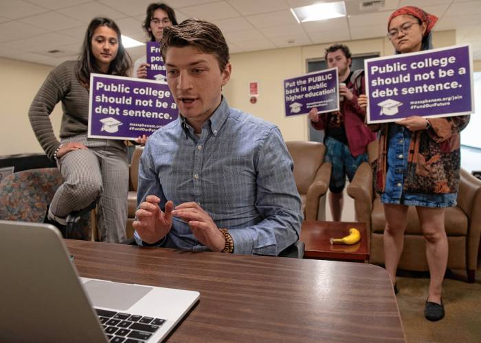 Mark Murdy, a University of Massachusetts Amherst graduate student, speaks at the board of trustees’ virtual meeting Wednesday to oppose tuition and fee hikes going into effect this fall with Ella Prabhakar, left, a member PHENOM, Public Higher Education Network of Massachusetts, and other UMass students. 