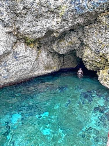 LEFT: Greenfield Recorder freelancer Aalianna Marietta in the cave at Rockhouse Hotel & Spa’s beach in Jamaica. RIGHT: Barney’s Flower and Hummingbird Garden in Jamaica.