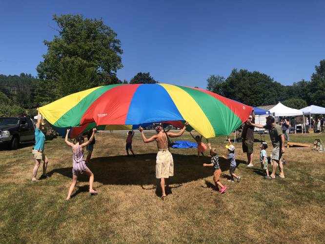Children playing games at the 2022 “Summer Day on the Buckland Common” event. The event returns for the eighth year on Saturday, July 20.