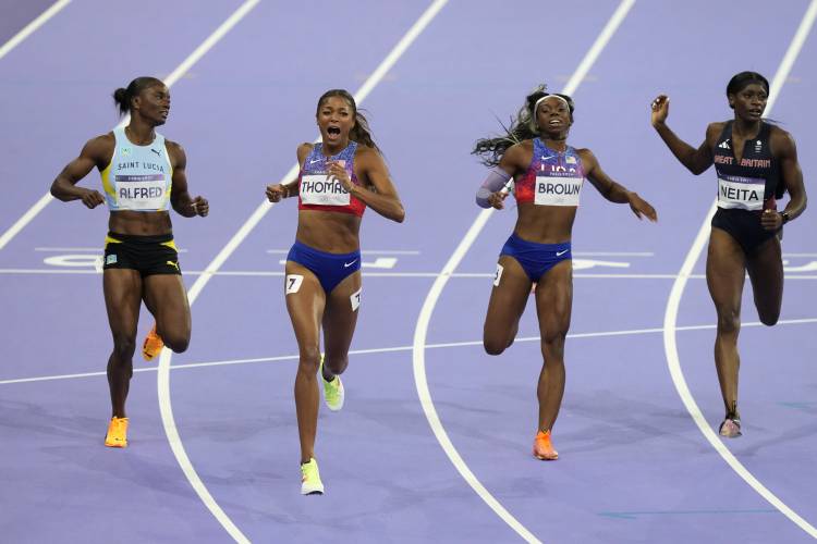 Florence’s Gabby Thomas crosses the finish line ahead of silver medalist Julien Alfred, of Saint Lucia, and bronze medalist Brittany Brown, of the United States, to win the gold medal in the women’s 200 meters final at the 2024 Summer Olympics on Tuesday in Saint-Denis, France. 