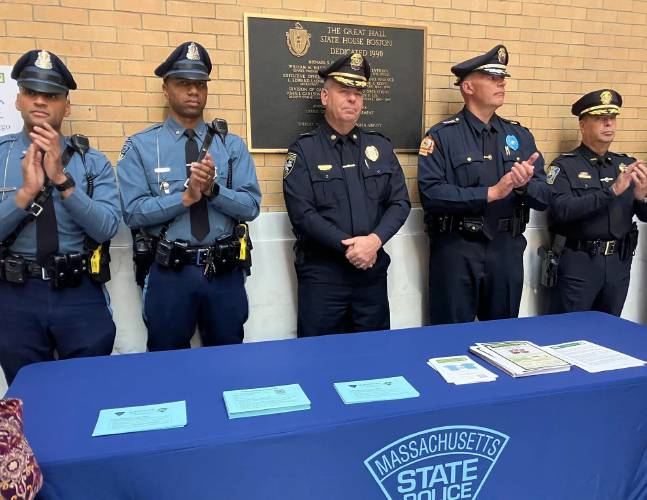 Massachusetts State Police showcase their new blue envelopes, designed to improve interactions with drivers on the autism spectrum, during an event hosted by Advocates for Autism of Massachusetts on Tuesday. Massachusetts State Police showcase their new blue envelopes, designed to improve interactions with drivers on the autism spectrum, during an event hosted by Advocates for Autism of Massachusetts on Tuesday.