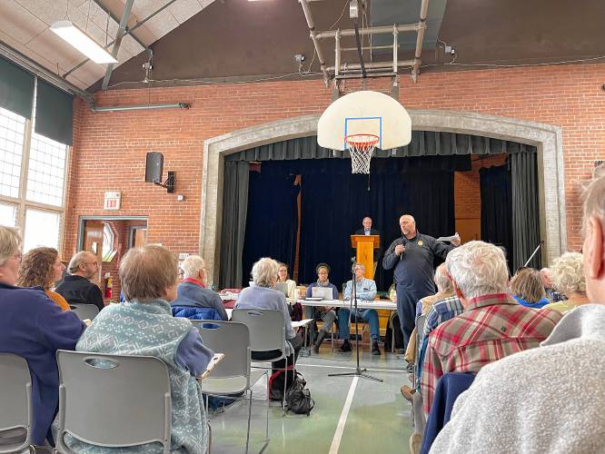 Police Chief Scott Minckler speaks during Leverett’s Annual Town Meeting on Saturday at Leverett Elementary School.
