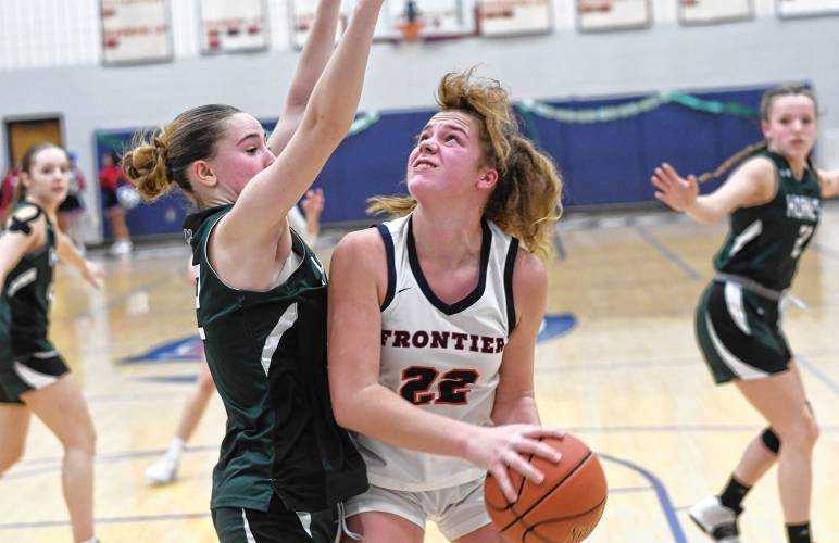 Frontier’s Harper Modestow looks to shoot past Manchester Essex defender Ella Arntsen during the Redhawks’ MIAA Division 4 Round of 32 victory at Goodnow Gymnasium in South Deerfield Thursday.