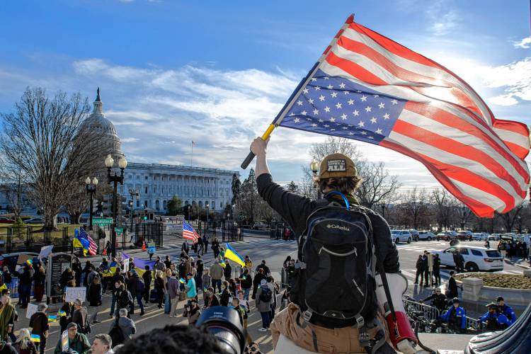 Sean Kratovil Lavelle joins other demonstrators across the street from the Capitol before President Trump’s address to a joint session of Congress on Tuesday.