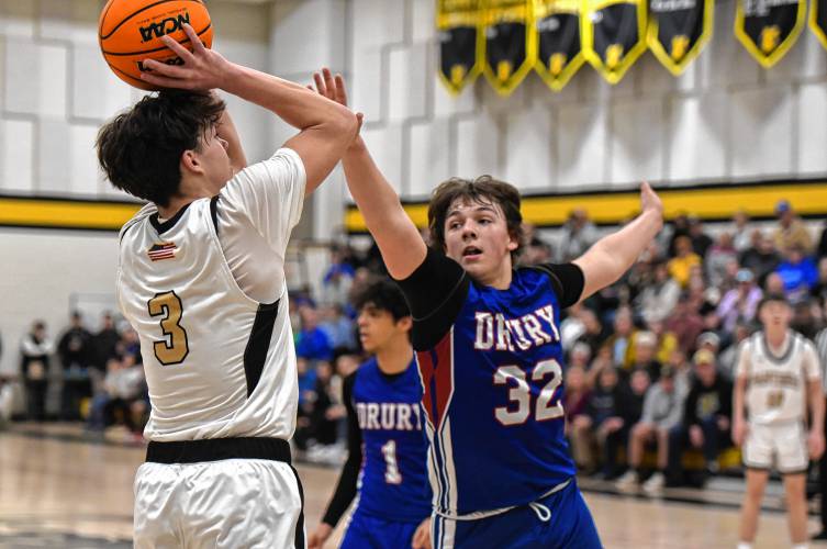 Pioneer’s Kurt Redeker (3) pulls up for a jump shot over Drury’s Connor Hinkell ()during the Panthers’ 54-44 victory in the MIAA Division 5 quarterfinal round on Saturday at Messer Gymnasium in Northfield.