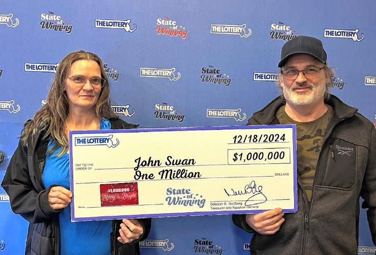 Greenfield resident John Swan was joined by his wife, Tracy, when he claimed his prize from the “$1,000,000 Merry & Bright” instant ticket game at the Massachusetts State Lottery’s Dorchester headquarters on Wednesday. Greenfield resident John Swan was joined by his wife, Tracy, when he claimed his prize from the “$1,000,000 Merry & Bright” instant ticket game at the Massachusetts State Lottery’s Dorchester headquarters on Wednesday.