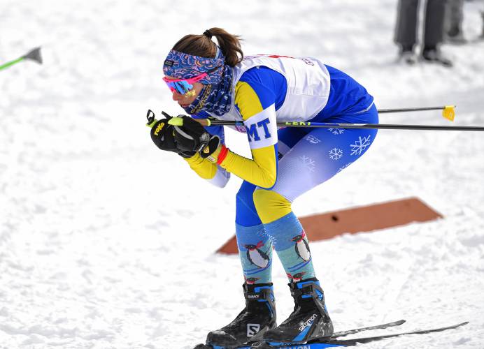 Mohawk Trail’s Charlotte Niswonger glides down a hill during the MIAA Nordic Ski Championships at Prospect Mountain in Woodford, Vt.