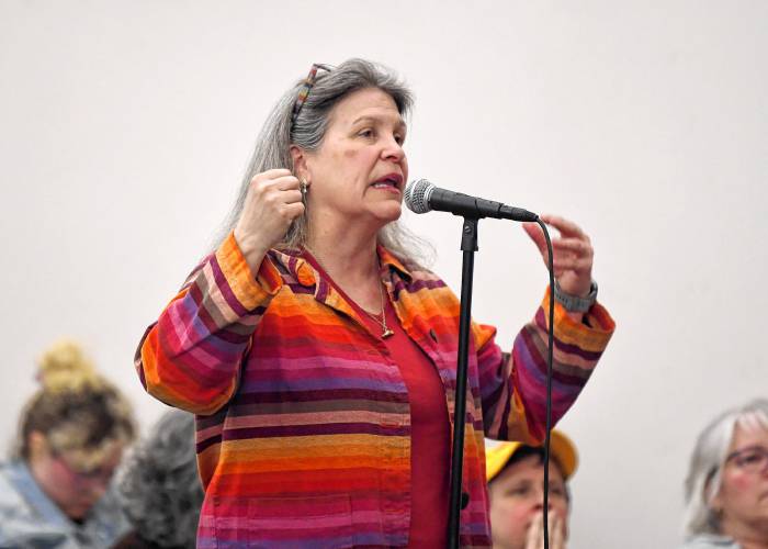 Rebecca Todd, executive director of the Connecticut River Conservancy, asks U.S. Rep. Jim McGovern about federal funding at a town hall event at Greenfield Middle School Tuesday evening.