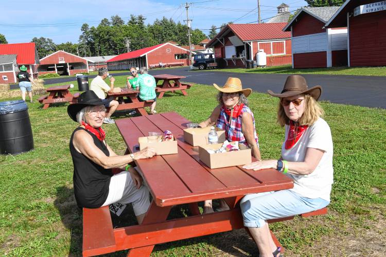 Joanne Belair, Marie Putala and Jane Oakes, all graduates of Turners Falls High School Class of 1969, sport cowboy hats to the rodeo-themed Big Brothers Big Sisters Point 5K fundraiser on Thursday at the Franklin County Fairgrounds.