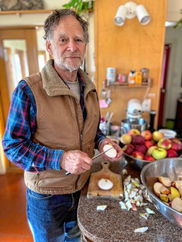 Upon moving to western Massachusetts 35 years ago, Northfield resident Bill Copeland was delighted to discover a wide range of apple varieties growing in our area. He's pictured making sauce, and one of his many hobbies involves fermenting cider to produce a sparkling beverage. Upon moving to western Massachusetts 35 years ago, Northfield resident Bill Copeland was delighted to discover a wide range of apple varieties growing in our area. He's pictured making sauce, and one of his many hobbies involves fermenting cider to produce a sparkling beverage.