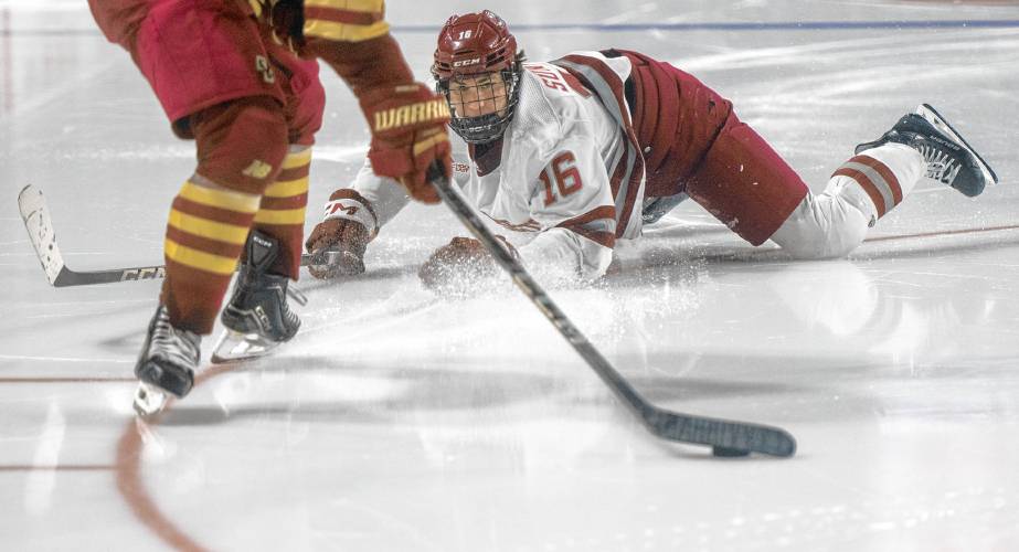 UMass right wing Aydar Suniev (16) dives after the puck during the college hockey game against Boston College at the Mullins Center, Saturday, Feb. 15, 2025, in Amherst.