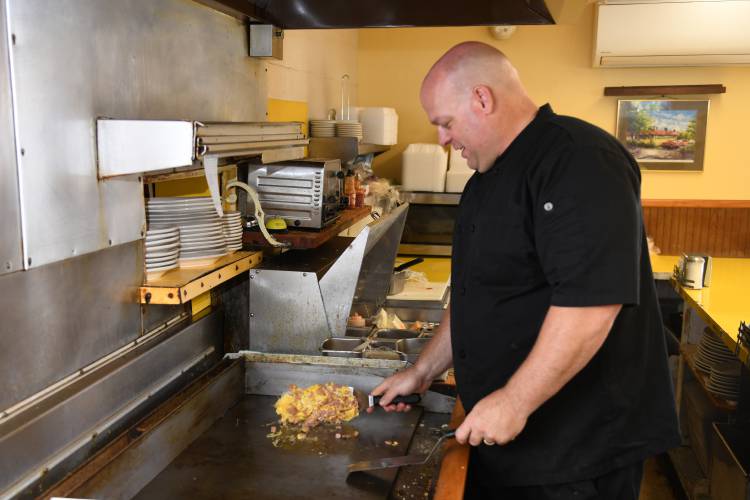 Owner Charles Garbiel cooks eggs at Shady Glen Diner on Avenue A in Turners Falls in June 2024. After nine months on the market, the business is still for sale.