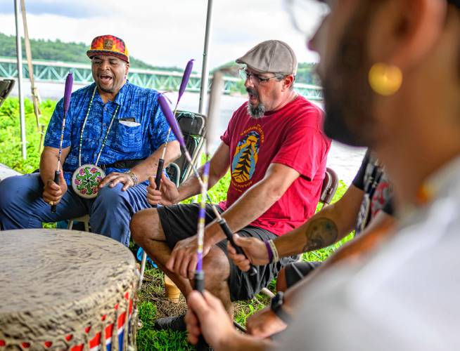 Hadley resident Justin Beatty, left, leads the Iron River singers as they perform during the Pocumtuck Homelands Festival, celebrating Native American art, music, and cultures at Unity Park in Turners Falls on Saturday.