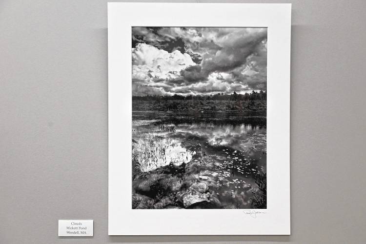 “Clouds, Wickett Pond, Wendell, MA,” one of 12 photos by Paul Jablon currently on display at the Greenfield Public Library.
