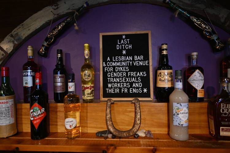 A sign behind the bar at Last Ditch states the venue’s mission to serve “Dykes, Transexuals, Gender Freaks, Workers, and their friends.”