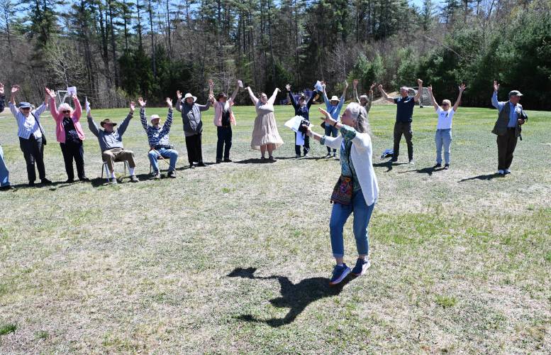 Clare Greene of the Warwick Community School Foundation welcomes those attending a belated Earth Day celebration at Warwick Community School on April 30.