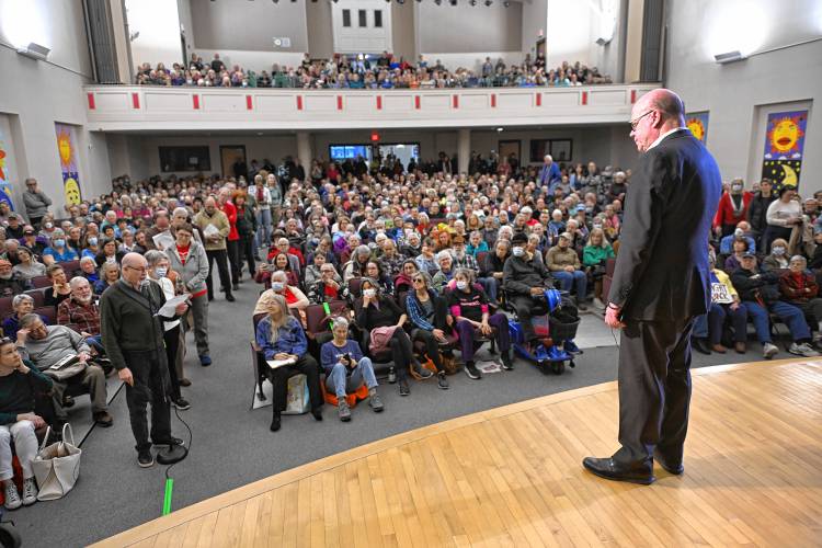 U.S. Rep. Jim McGovern listens to a question from Greenfield resident Michael Nix at a town hall event at Greenfield Middle School Tuesday evening. 