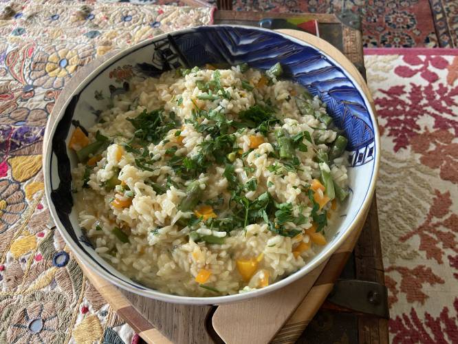 One could argue that risotto is inconvenient since it keeps the cook in the kitchen away from her dinner guests. My solution to this problem is to ask my guests to gather for cocktails and conversation around my kitchen table so we can spend time together as I stir the risotto.