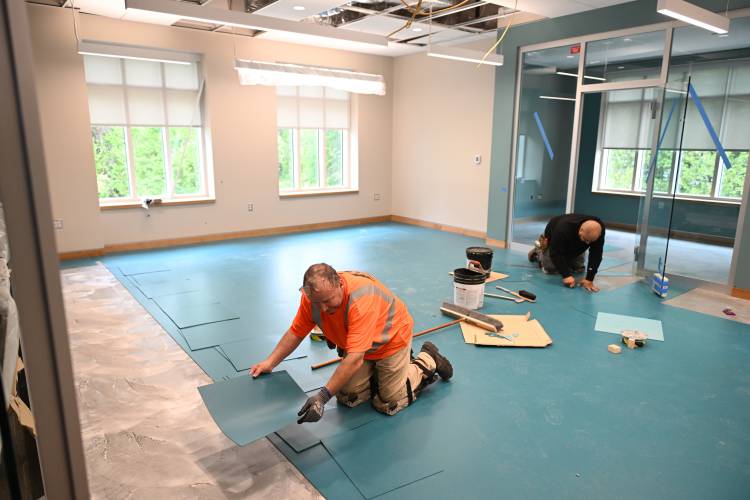 Flooring is installed in the teen room and maker space in this second floor room of the addition to the Tilton Library in South Deerfield.