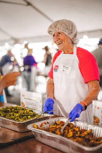 Mayor Ginny Desorgher helps serve meals during the 2023 Harvest Supper on the Greenfield Common. The 19th annual event will be held Saturday, Aug. 24, from 4 to 7 p.m.