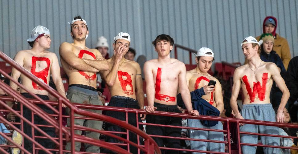 UMass fans with body paint that spells out 'BC BLOW' watch the final minutes of a game against Boston College at the Mullins Center, last month in Amherst.