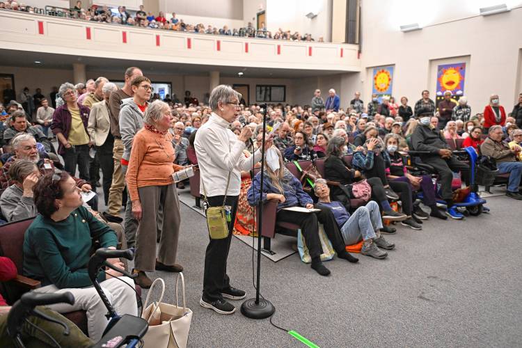 People line up to speak to and ask questions of U.S. Rep. Jim McGovern at a town hall event at Greenfield Middle School Tuesday evening.