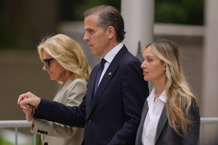 Hunter Biden, center, President Joe Biden's son, accompanied by his mother, first lady Jill Biden, left, and his wife, Melissa Cohen Biden, right, walking out of federal court after hearing the verdict, Tuesday, June 11, 2024, in Wilmington, Del. Hunter Biden has been convicted of all 3 felony charges in the federal gun trial. (AP Photo/Matt Rourke)