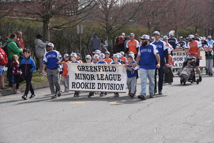  Members of Greenfield Minor League Baseball make their way to Lunt Field during the Opening Day Parade last year. 