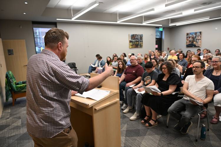 Christian Drake does an encore reading of his poem at Poet’s Seat Poetry Contest awards ceremony at the Greenfield Public Library on Tuesday evening.