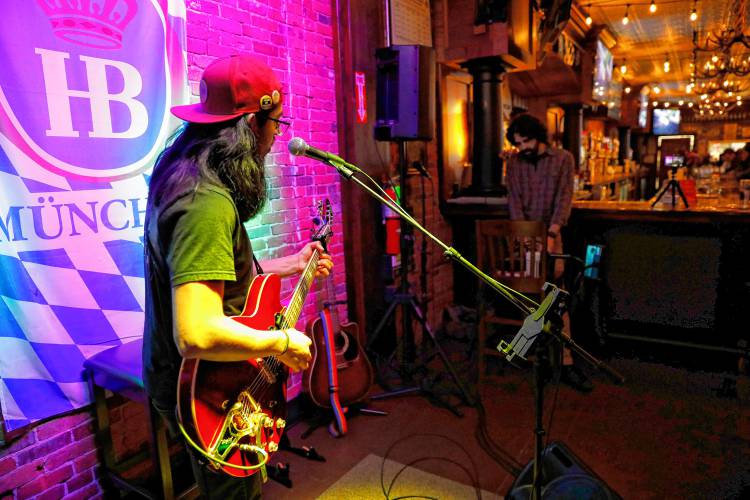 Alex Davis performs during the weekly open mic night at Wurst Haus in Northampton.