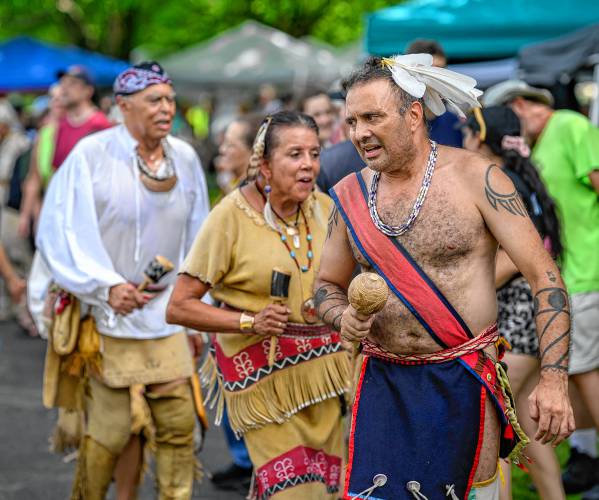 Wampanoag Nation Singers and Dancers members John “Jim” Peters Jr., executive director of the Massachusetts’ Commission on Indian Affairs, left, Kitty Hendricks and Hartman Deetz perform during the Pocumtuck Homelands Festival, celebrating Native American art, music and cultures at Unity Park in Turners Falls on Saturday.