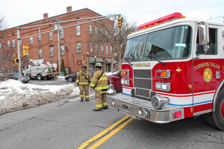 Turners Falls firefighters close off a portion of Avenue A after a report of a gas leak from the basement of The Upper Bend on Friday afternoon.