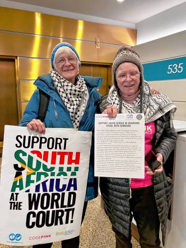 Sherrill Hogen, left, of Charlemont, and Paki Wieland, of Greenfield, were accompanied by (not pictured) Dorothea Melnicoff, also of Greenfield, and Priscilla Lynch, of Conway, in Boston as part of an effort by a coalition of peace organizations calling on nation-states to unite with South Africa in charging Israel with genocide for its actions in Gaza. Sherrill Hogen, left, of Charlemont, and Paki Wieland, of Greenfield, were accompanied by (not pictured) Dorothea Melnicoff, also of Greenfield, and Priscilla Lynch, of Conway, in Boston as part of an effort by a coalition of peace organizations calling on nation-states to unite with South Africa in charging Israel with genocide for its actions in Gaza.