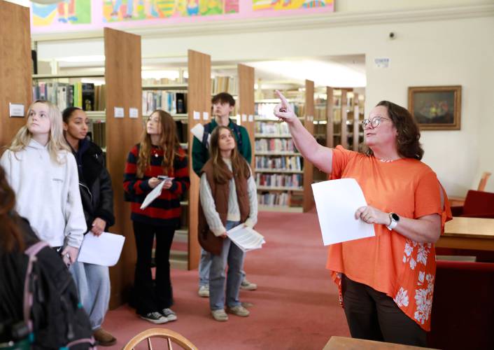 Jones Library director Sharon Sharry, right, leads a tour for the UMass landscape architecture sophomore studio class Wednesday afternoon in Amherst.