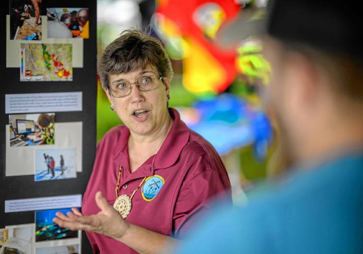 Cheryl Stedtler, director of Project Mishoon, discusses the journey behind the discovery of ancient dugout canoes known as mishoonash during the Pocumtuck Homelands Festival, celebrating Native American art, music and cultures at Unity Park in Turners Falls on Saturday.  