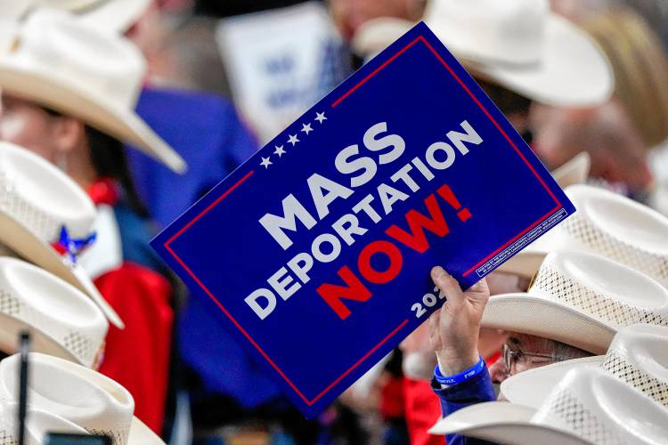 A member of the Texas delegation holds a sign during the Republican National Convention on July 17 in Milwaukee.
