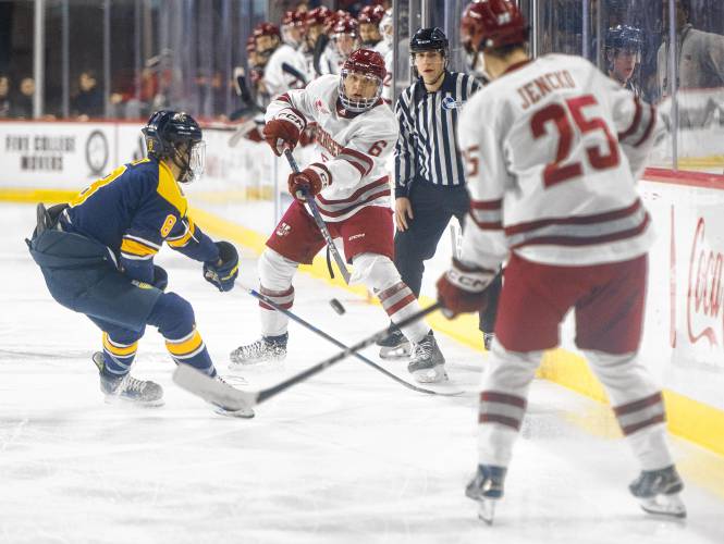 UMass defenseman Lucas Ölvestad (6) passes the puck down the ice during Saturday’s game against Merrimack at the Mullins Center in Amherst.