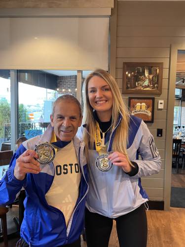 Kate Bitters with her running coach, Alberto Colin, after completing the 129th Boston Marathon last month. 