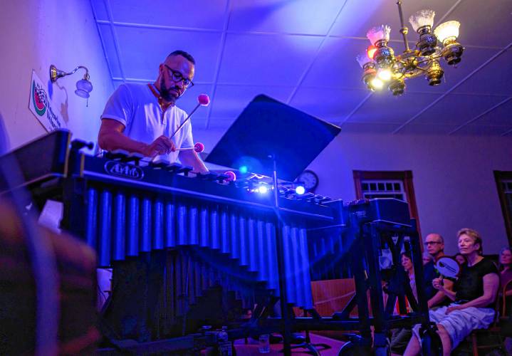 Drew Tucker performs on vibraphone during a Watermelon Wednesdays concert at the West Whately Chapel earlier this month. The acoustic music series is celebrating 25 years.