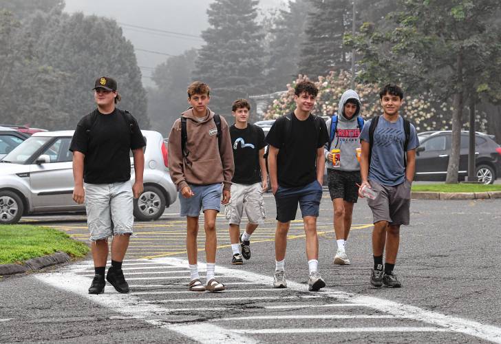 Students arrive for the first day of school at Frontier Regional School in South Deerfield on Tuesday.