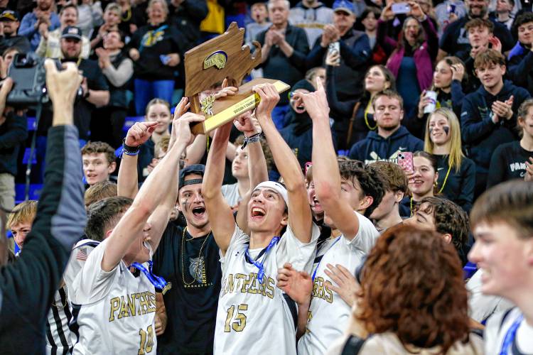 Pioneer players celebrate with fans after their 49-28 win over Hopedale for the MIAA Div. 5 state championship Saturday at the Tsongas Center in Lowell. 